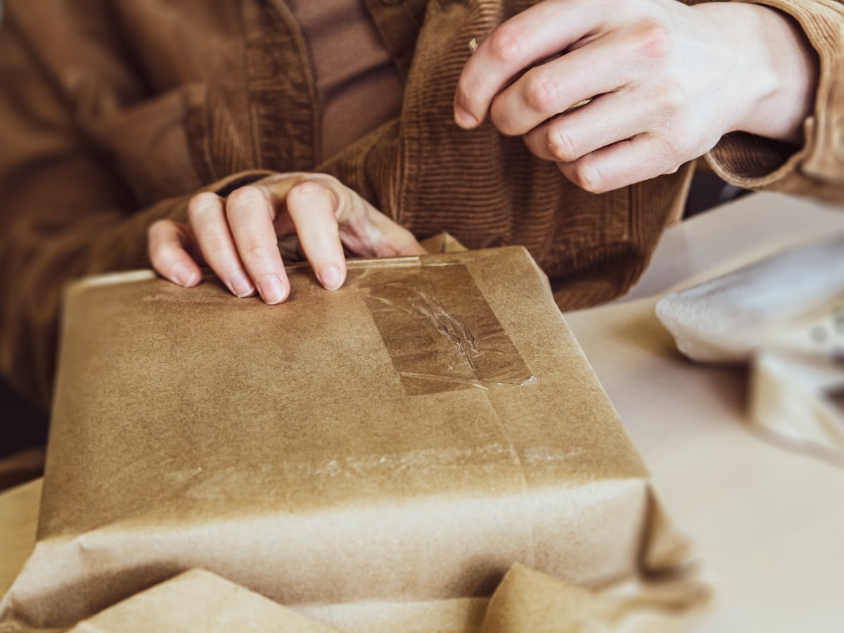 Wrapping a parcel at the Brackish Goods counter
